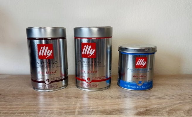 illy 3 cans on table