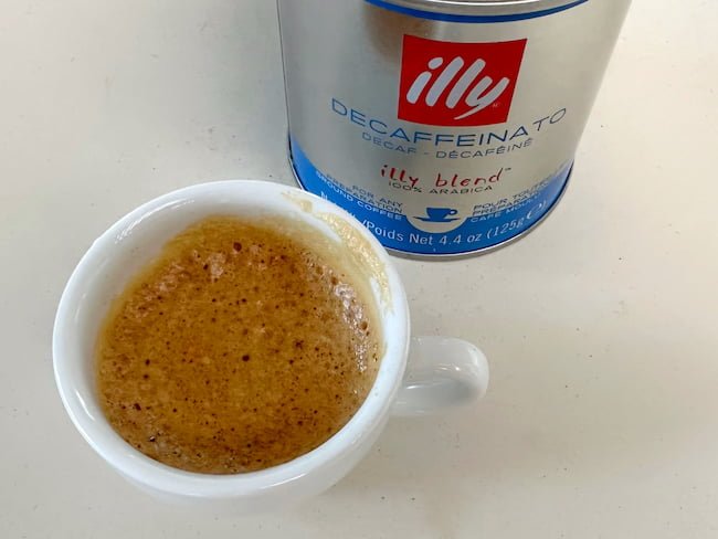 Illy decaf espresso shot next to canister
