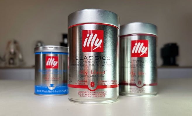 3 illy cans on table
