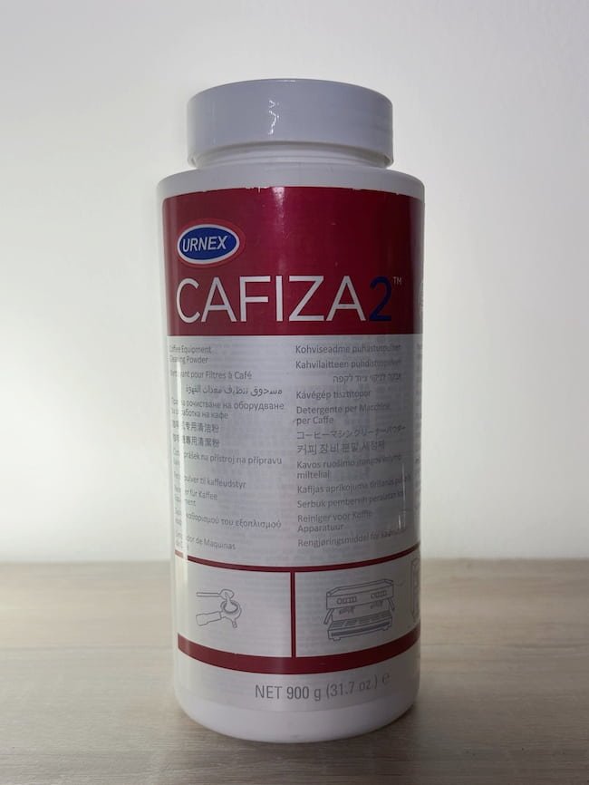 cafiza cleaning powder on table clean background