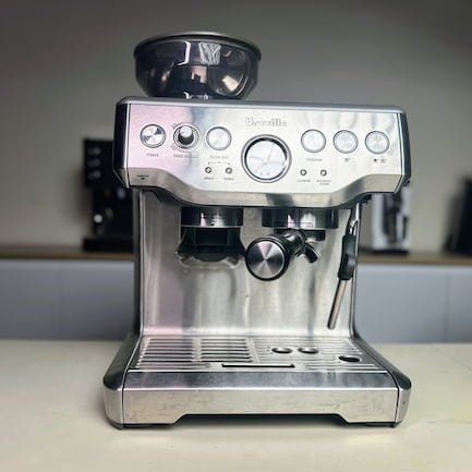 breville barista express on table